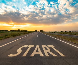 word start painted on a road with a sunset 