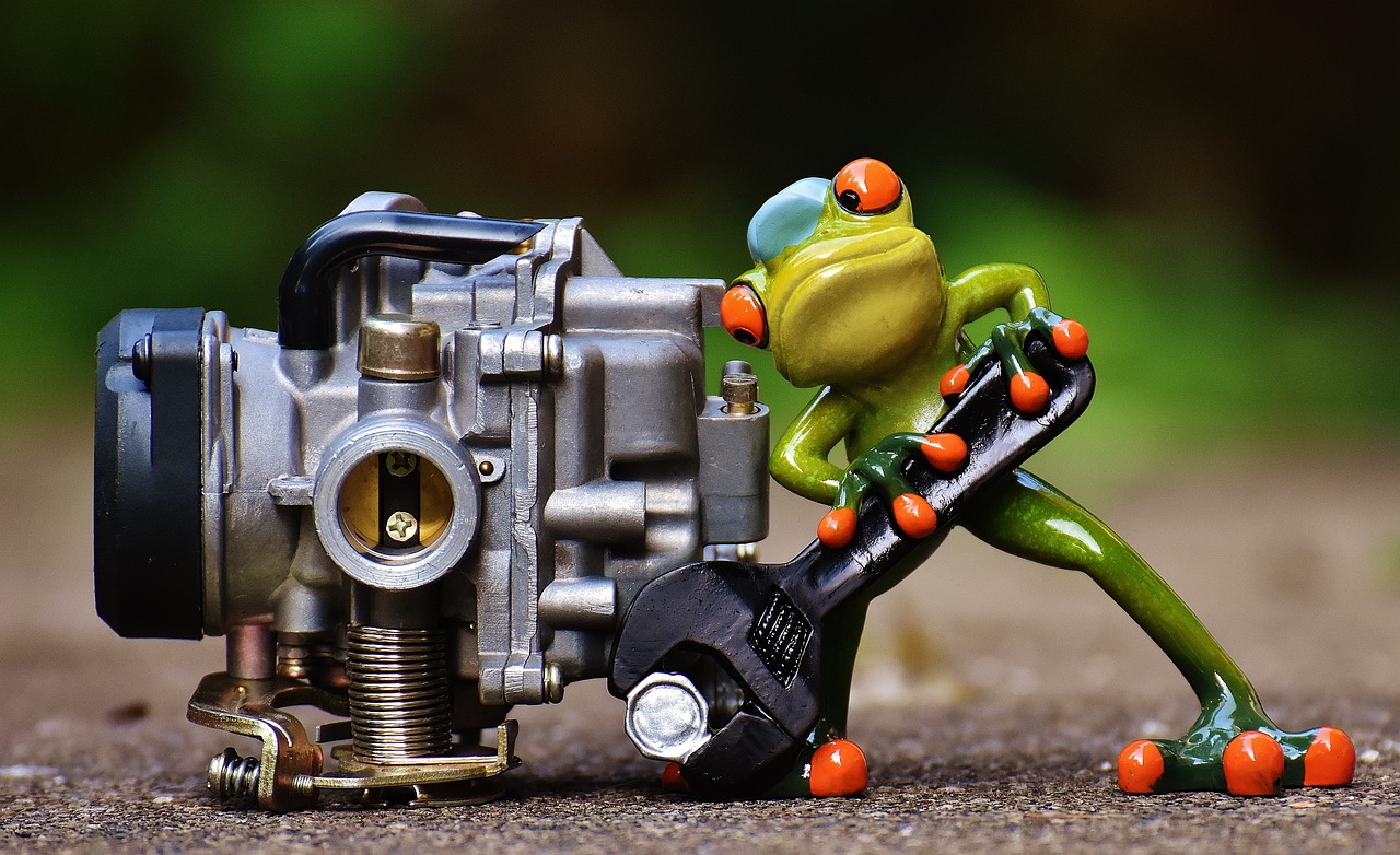 frog mechanic working on an engine