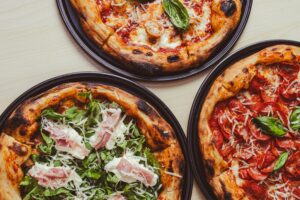 Three different pizzas illustrate the complexity behind ordering what seems like a simple food.