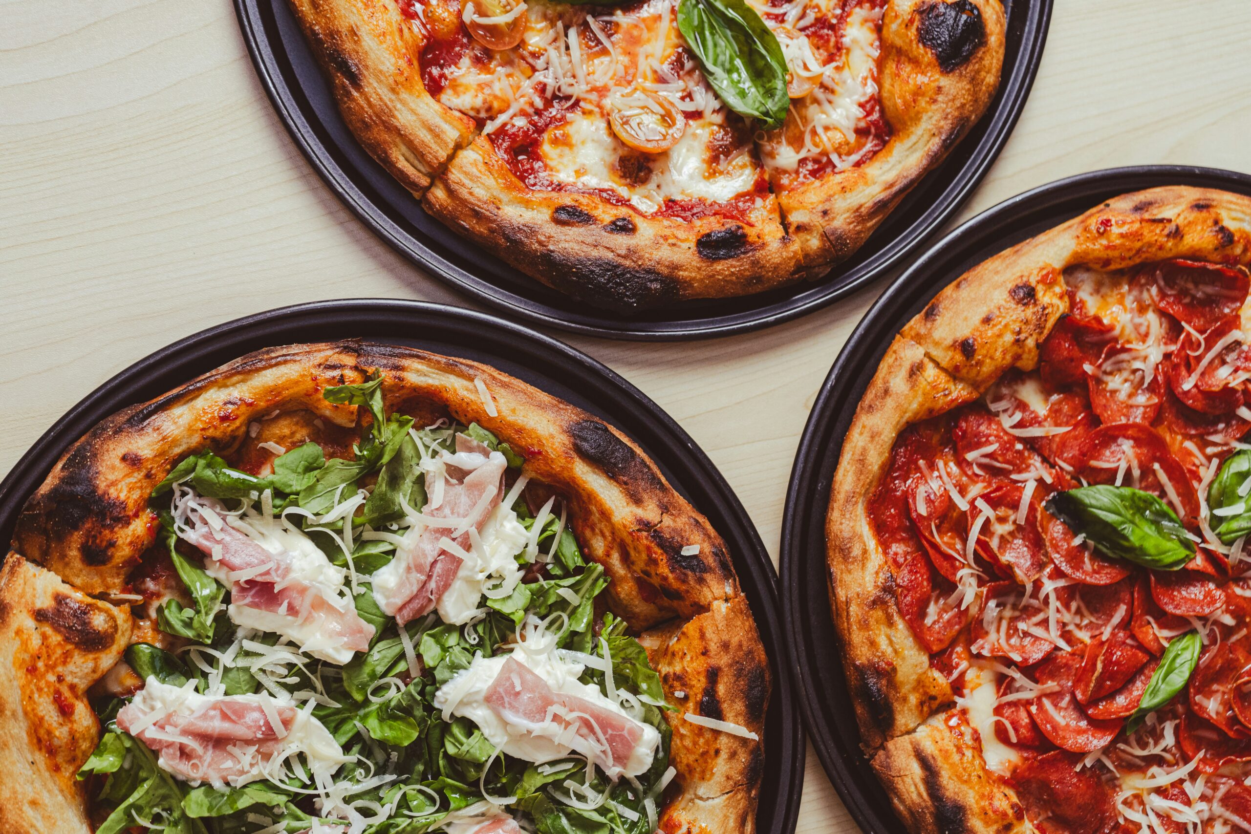 Three different pizzas illustrate the complexity behind ordering what seems like a simple food.