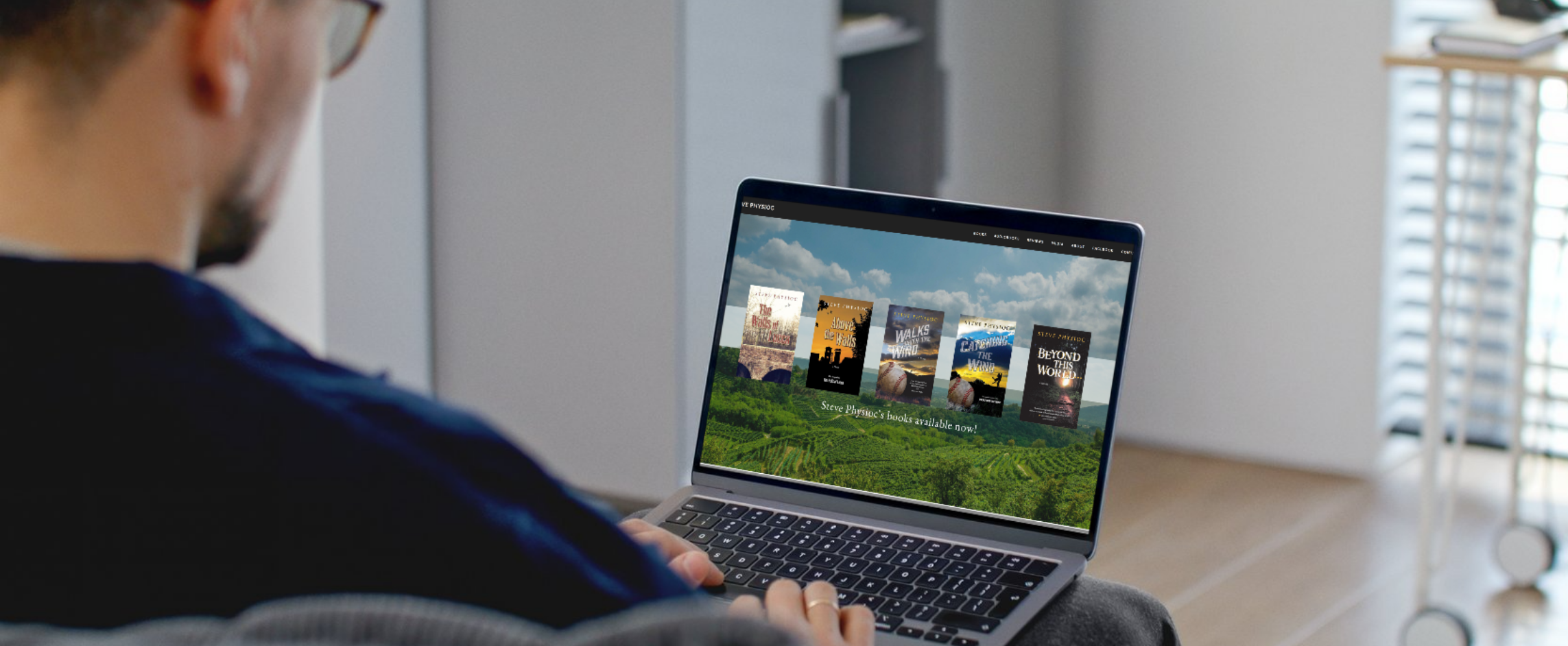 man looking at StevePhysioc.com on his laptop