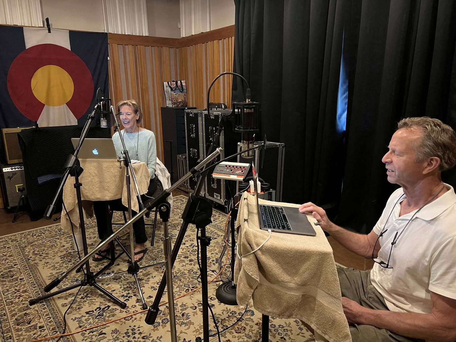 Steve Physioc reading at the microphone during an audiobook recording session