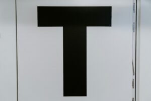 The letter "T" in black on a white background, representing Trustworthiness in Google's EEAT framework.